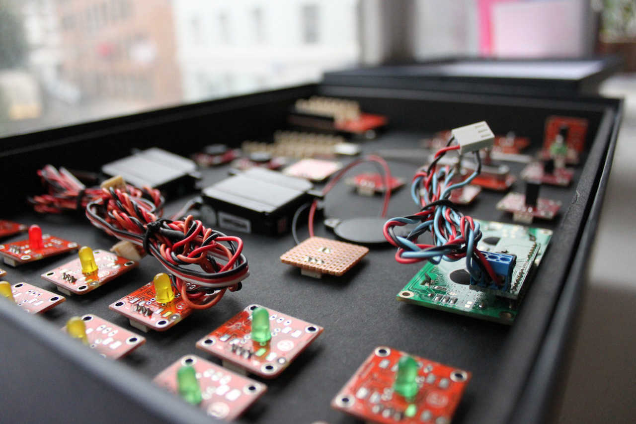 Photo of several small circuit boards packaged in a box.